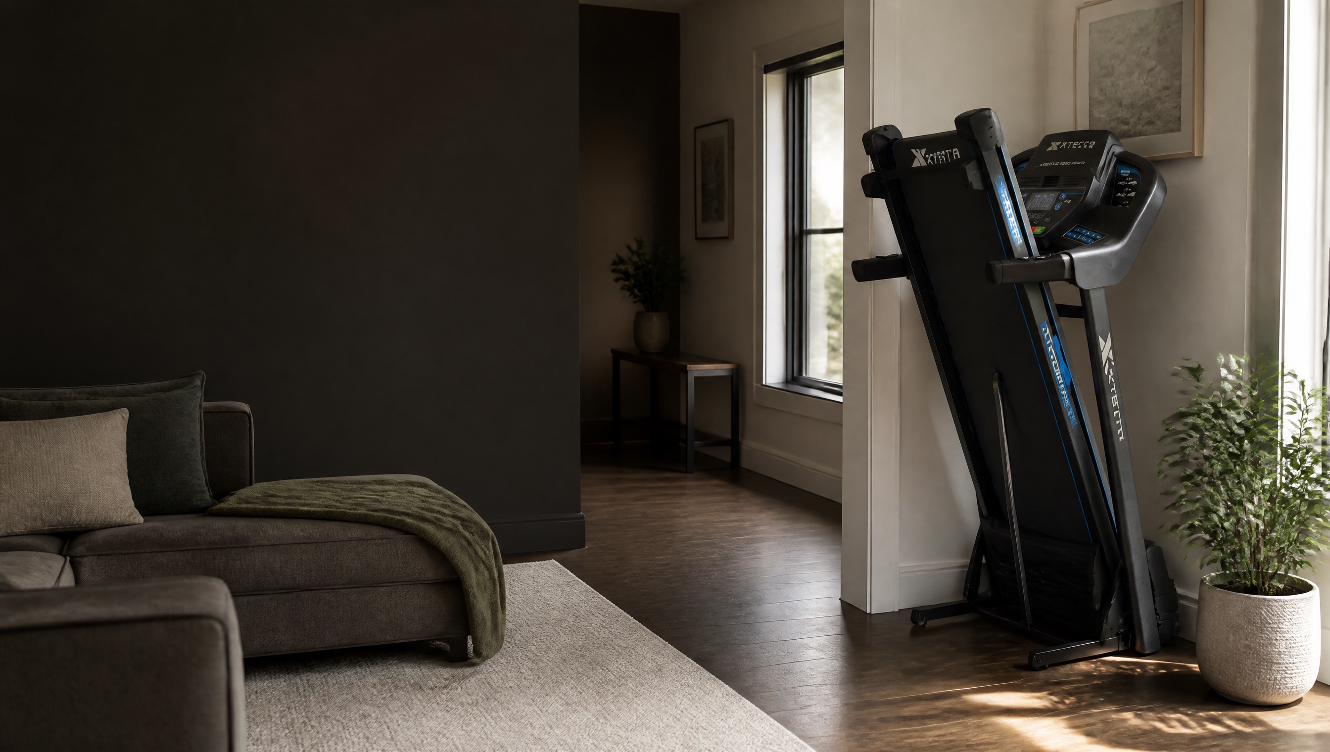 A folded XTERRA treadmill stored in a modern living room