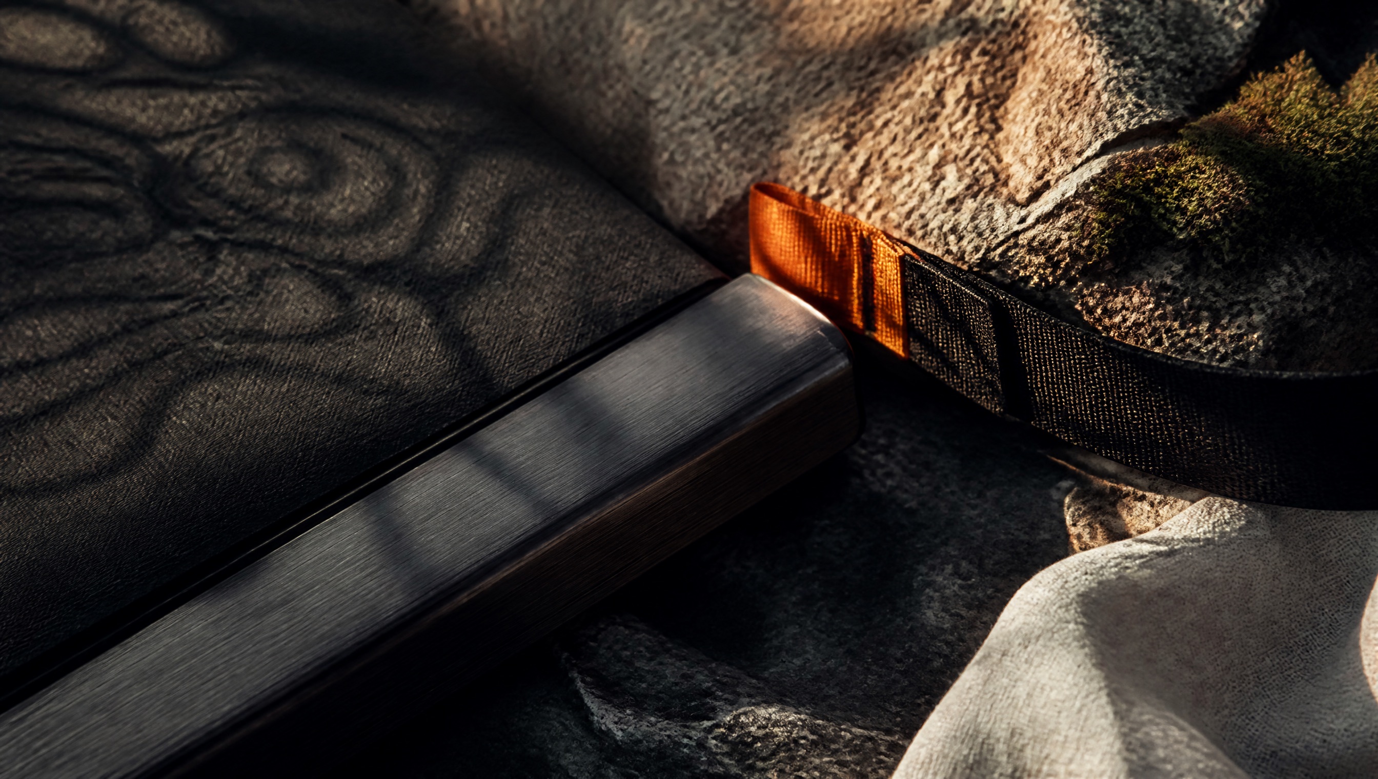 XTERRA material language of belt rubber, metal, webbing, stone, and linen