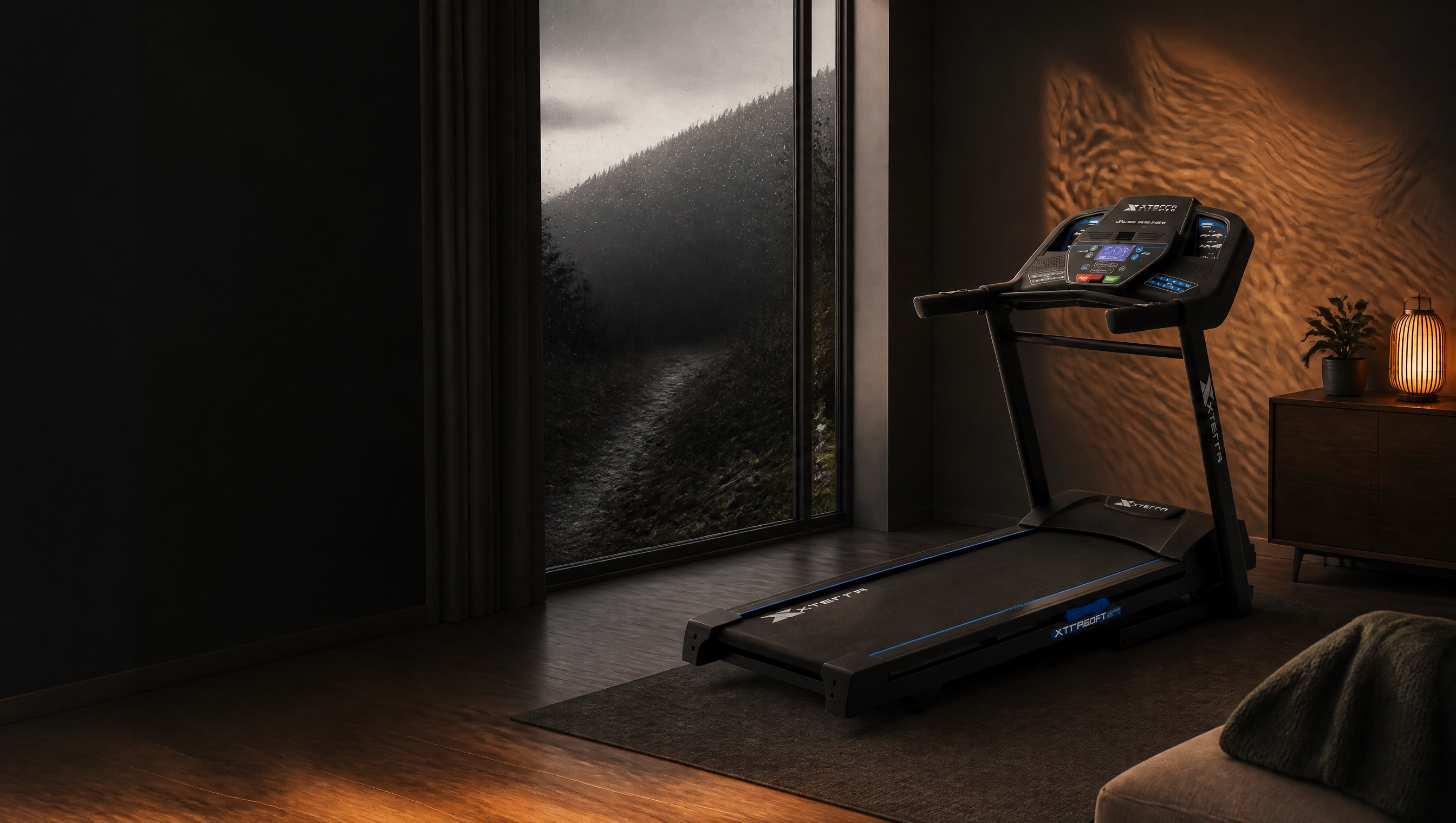 An XTERRA treadmill in a warm home while rain closes the outdoor trail